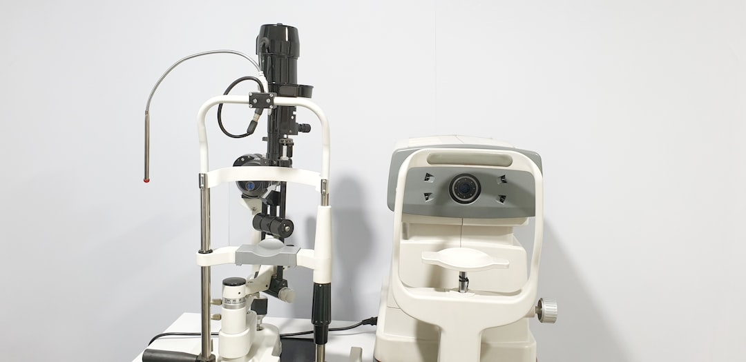 optometrist conducting slit lamp biomicroscopy examination optometrist conducting slit lamp biomicroscopy examination