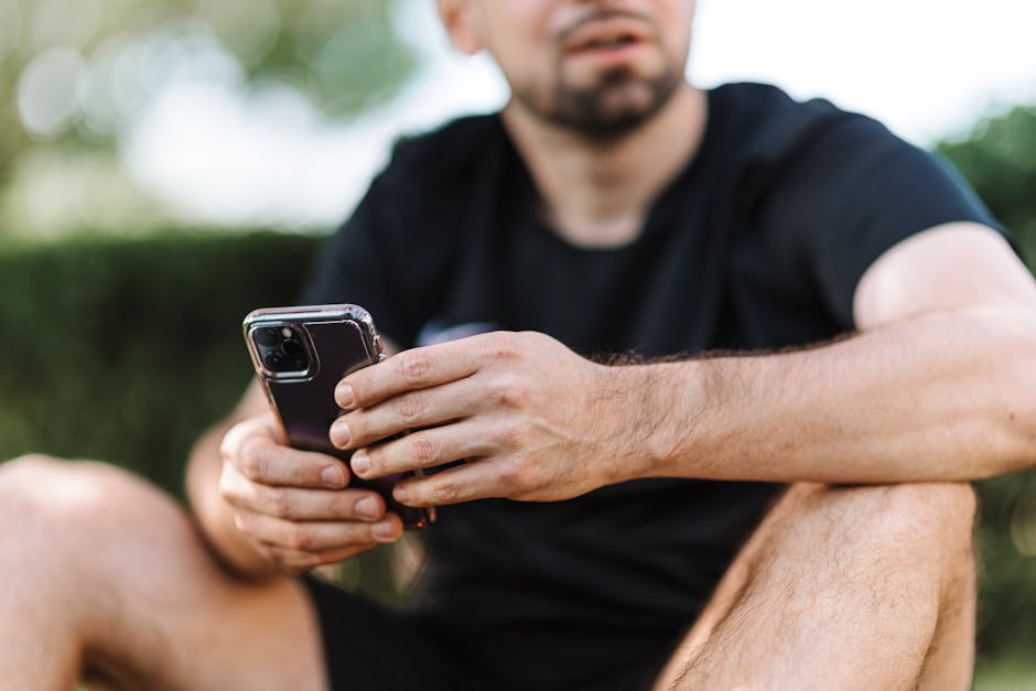 Adult holding smartphone at arm's length to read a message - Presbyopia